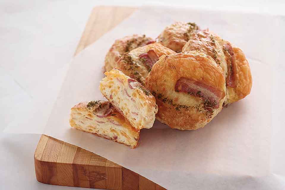 Cheddar Bacon Buttermilk Biscuits ':' Impress your brunch guests with these easy and delicious savoury biscuits, brought to you by Chef Leopold Newsimal and taken from our Seasons cookbook.